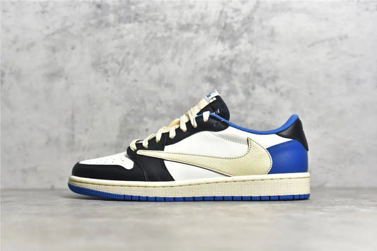 "Air Jordan 1 Low Travis Scott x Fragment – Iconic sneaker featuring a mix of white, blue, and black leather with Travis Scott’s signature reverse Swoosh and Fragment branding."