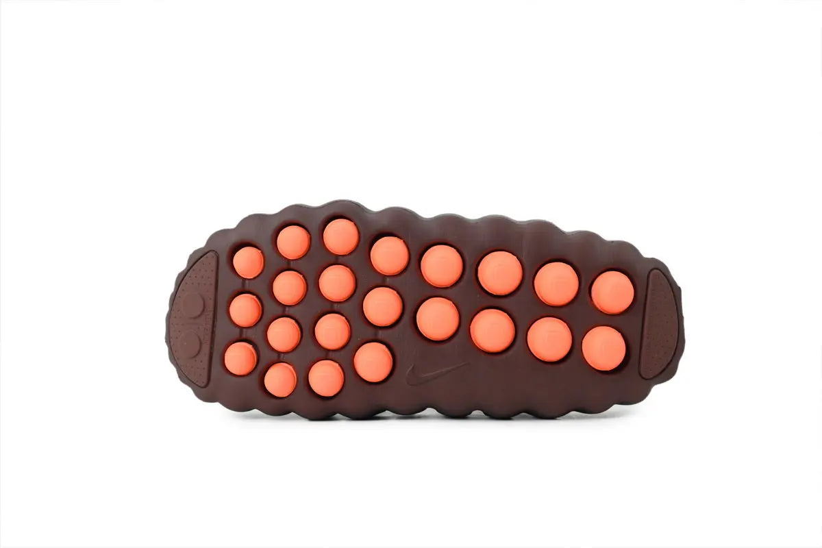 Nike Mind 001 FlyKnit Slide Total Orange rubber outsole traction pattern bottom view