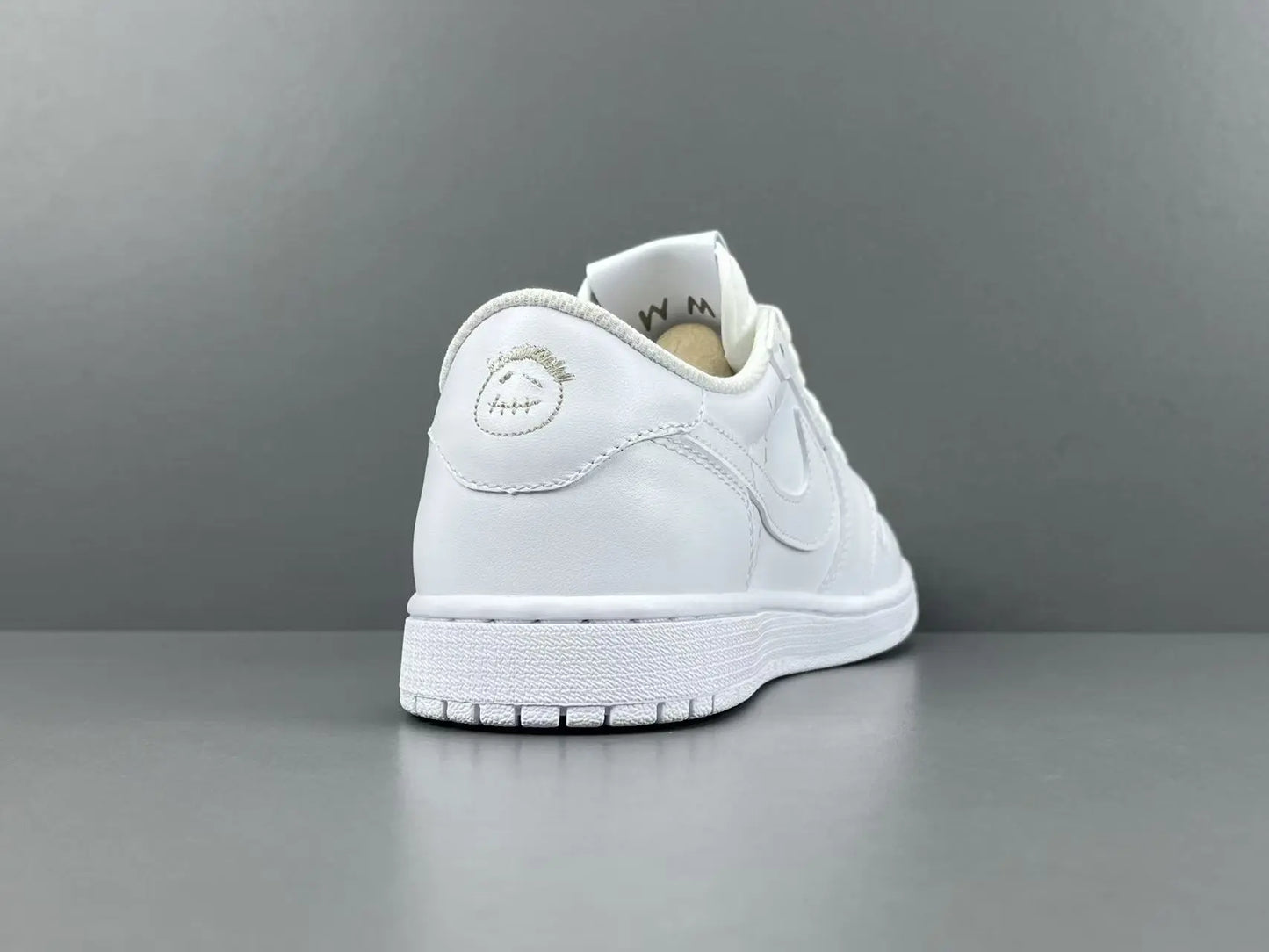 Air Jordan 1 Low Travis Scott White side view reverse Swoosh leather sneaker