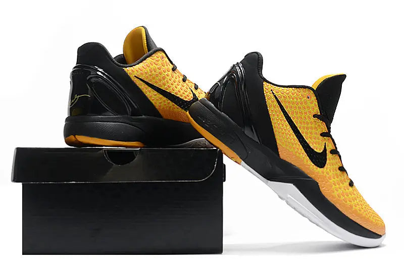 Nike Kobe 6 Protro Lightbulb edition sneakers in bright yellow with sleek low-top design.
