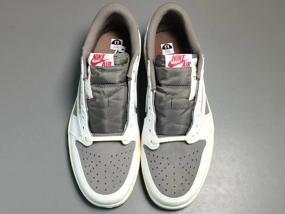 "Jordan 1 Low x Travis Scott Reverse Mocha – Mocha suede, reverse Swoosh, Cactus Jack branding, and vintage sail accents."