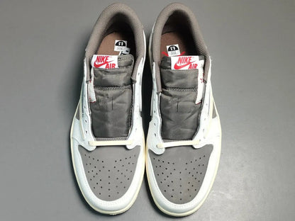 "Jordan 1 Low x Travis Scott Reverse Mocha – Mocha suede, reverse Swoosh, Cactus Jack branding, and vintage sail accents."