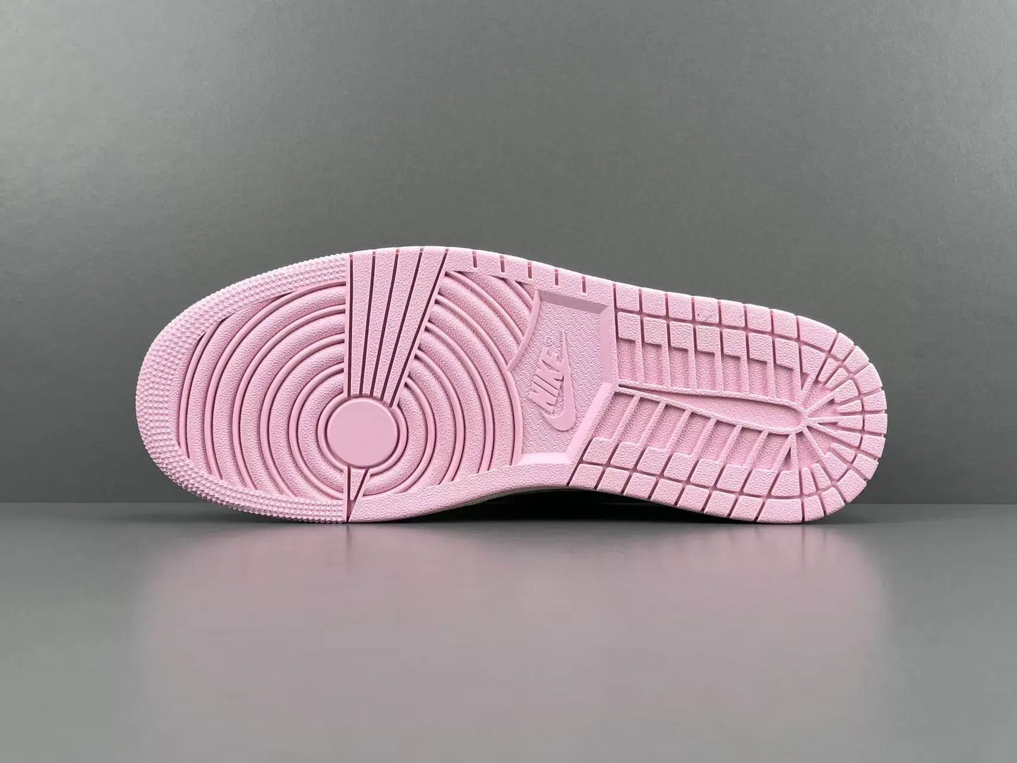 Jordan 1 Low Travis Scott Muslin Shy Pink sneakers with reverse Swoosh
