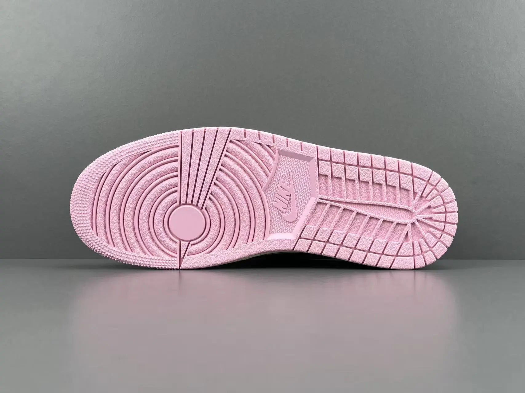 Jordan 1 Low Travis Scott Muslin Shy Pink sneakers with reverse Swoosh
