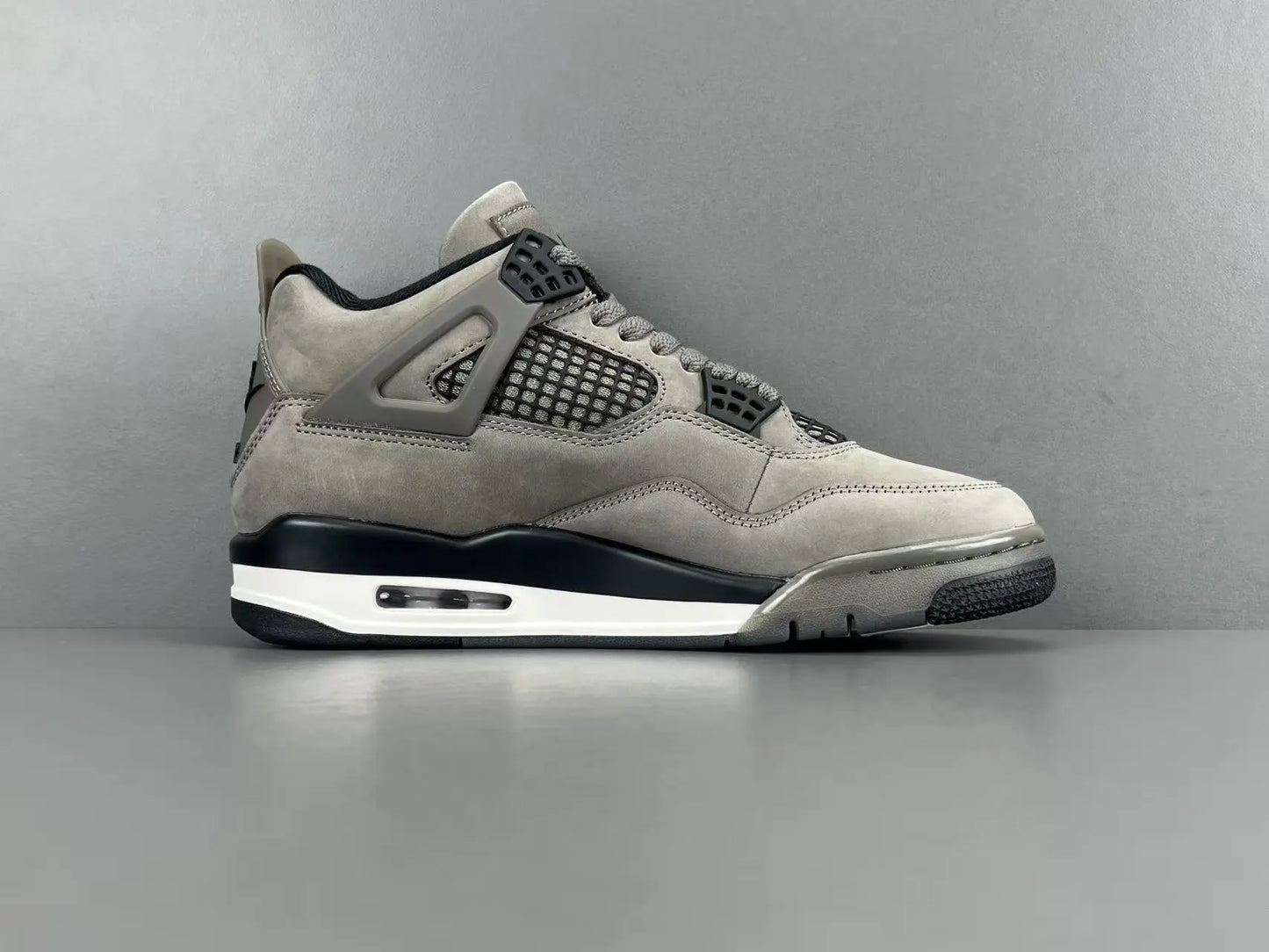 Air Jordan 4 x Cave Stone sneakers featuring premium materials neutral tones
