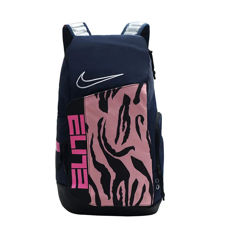 A Nike athletic backpack in navy blue with a pink front panel featuring a black zebra-like pattern and pink 'ELITE' text, shown on a plain white background.