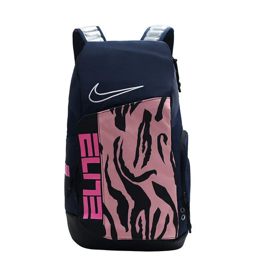 A Nike athletic backpack in navy blue with a pink front panel featuring a black zebra-like pattern and pink 'ELITE' text, shown on a plain white background.