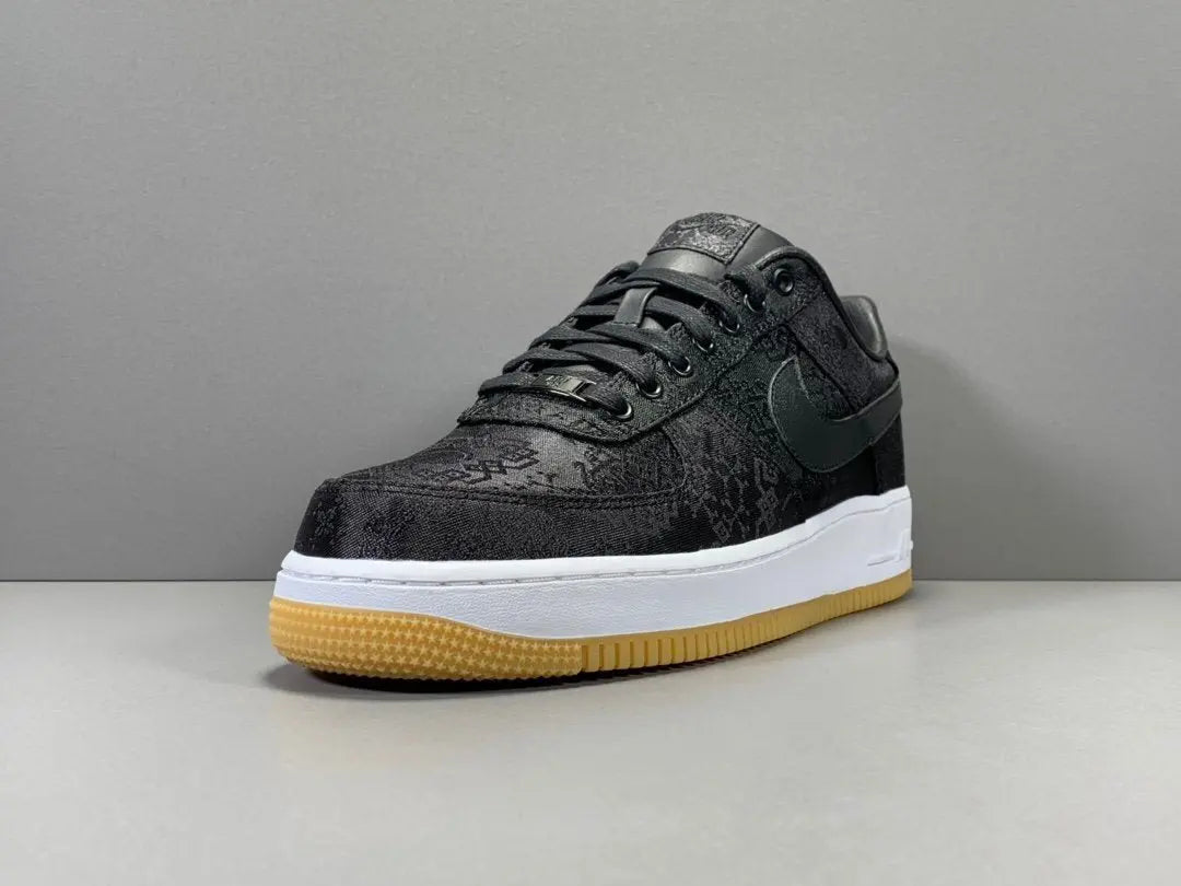 White Nike Air Force 1 x Fragment CLOT collaboration sneaker with logos
