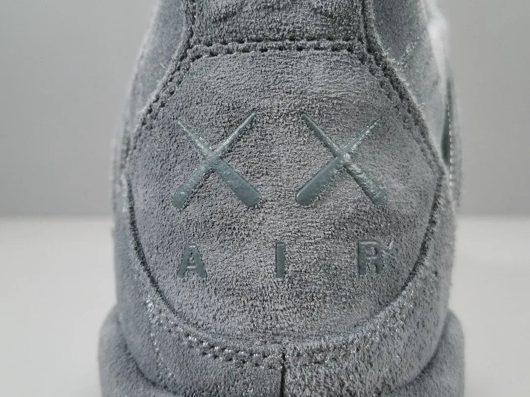 Close-up of a textured gray sneaker with 'XX Air' branding on a light background