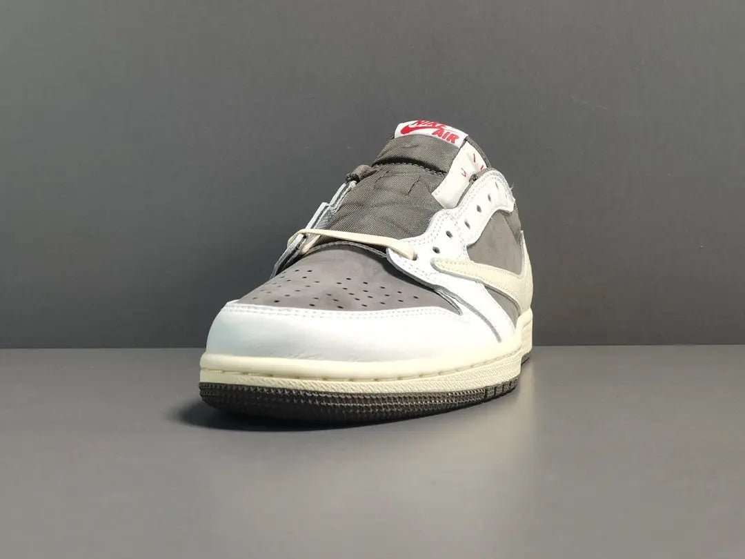 "Jordan 1 Low x Travis Scott Reverse Mocha – Mocha suede, reverse Swoosh, Cactus Jack branding, and vintage sail accents."