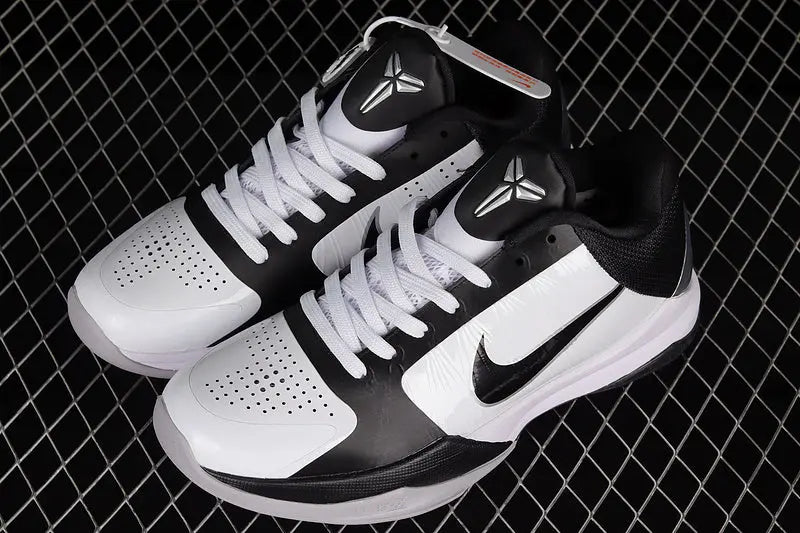 Top-down view of Nike Kobe 5 Protro White/Black featuring the embroidered Kobe Sheath logo on the tongue and lace-up closure on a predominantly white upper