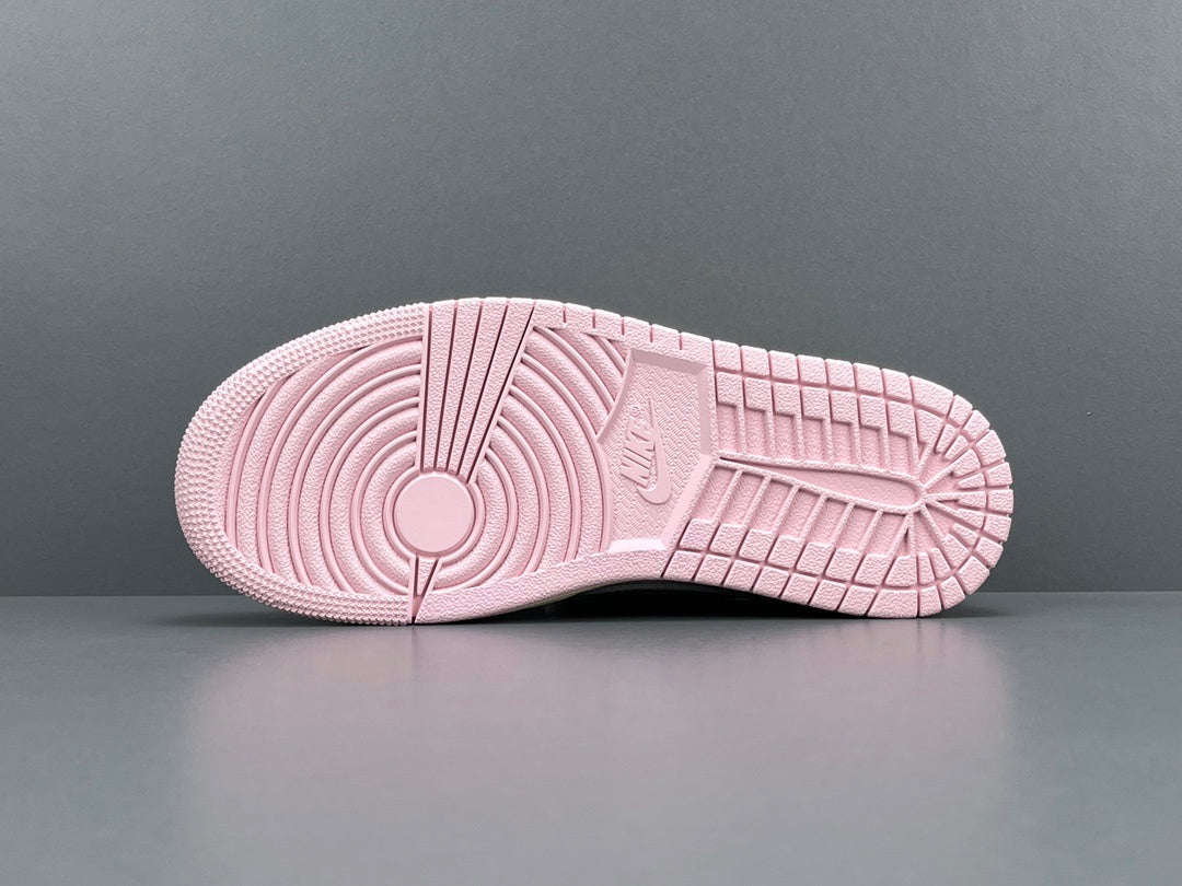 Jordan 1 Low x Travis Scott Shy Pink sneakers with reversed Swoosh design