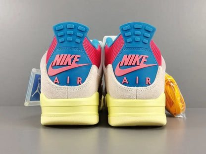 Pair of Nike Air shoes with blue, pink, and yellow design on a gray background