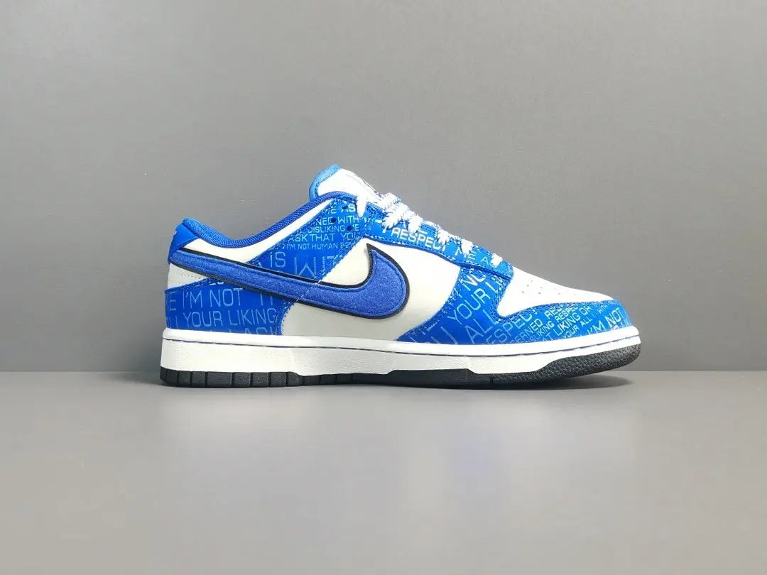 Nike Dunk Low “Jackie Robinson” sneaker with black, grey, and royal blue accents honoring the baseball legend
