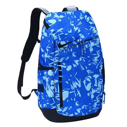A Nike backpack featuring a vibrant blue and light blue abstract pattern, with black straps, zippers, and a black swoosh logo on the front.
