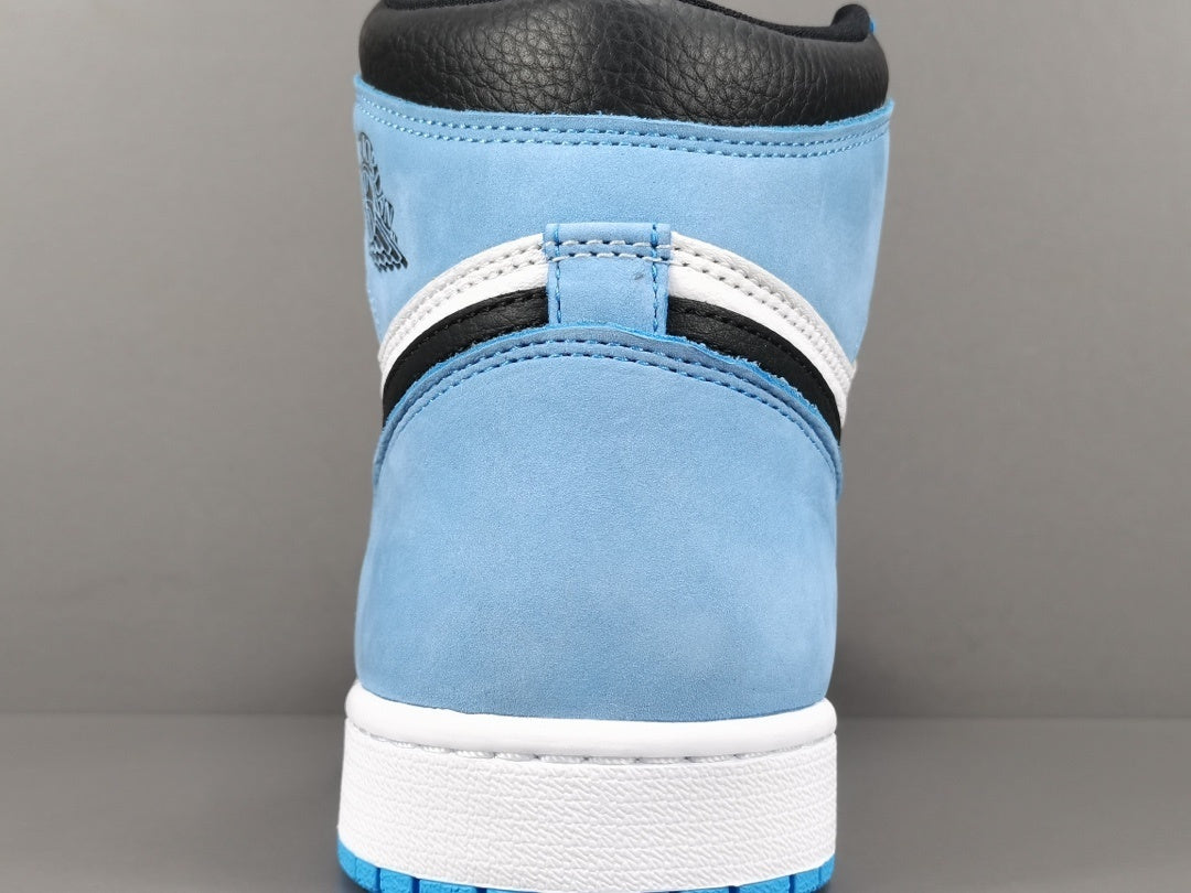 Jordan 1 Retro High OG University Blue sneakers with suede overlays and classic style.