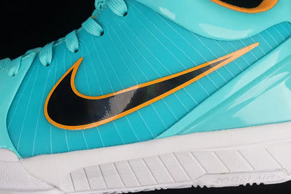 Close-up of a Nike sneaker in turquoise with a black Swoosh outlined in orange, a white sole, and turquoise laces against a black background.