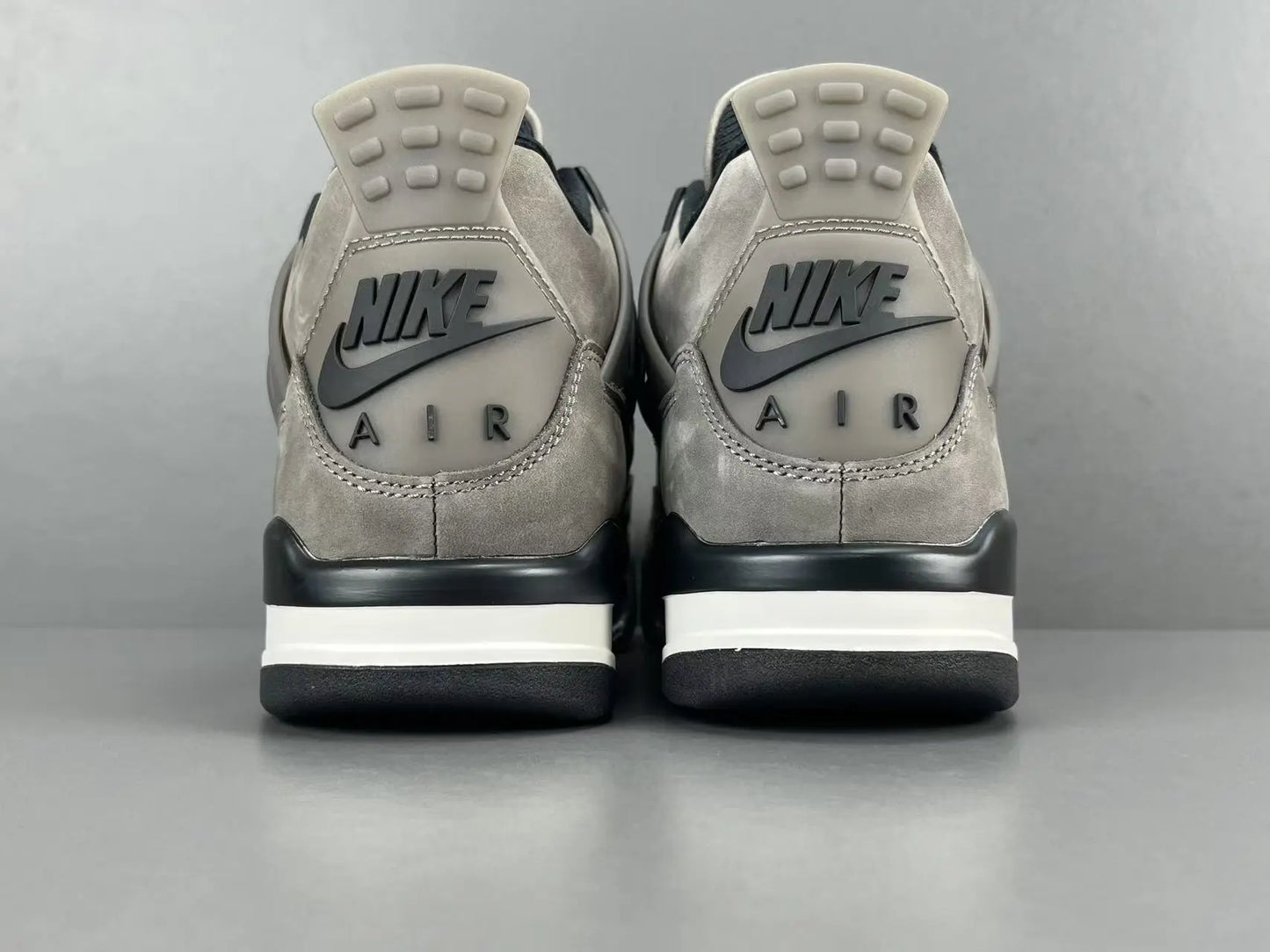 Air Jordan 4 x Cave Stone sneakers featuring premium materials neutral tones
