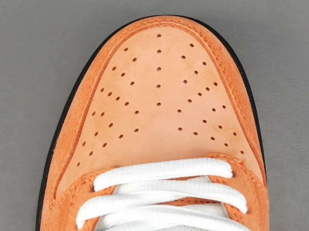 Nike SB Dunk Concepts Orange Lobster suede and leather texture close up