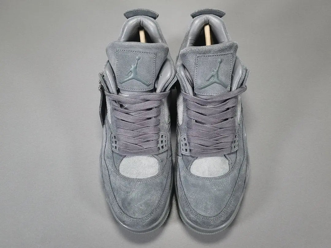Gray high-top sneakers on a gray background