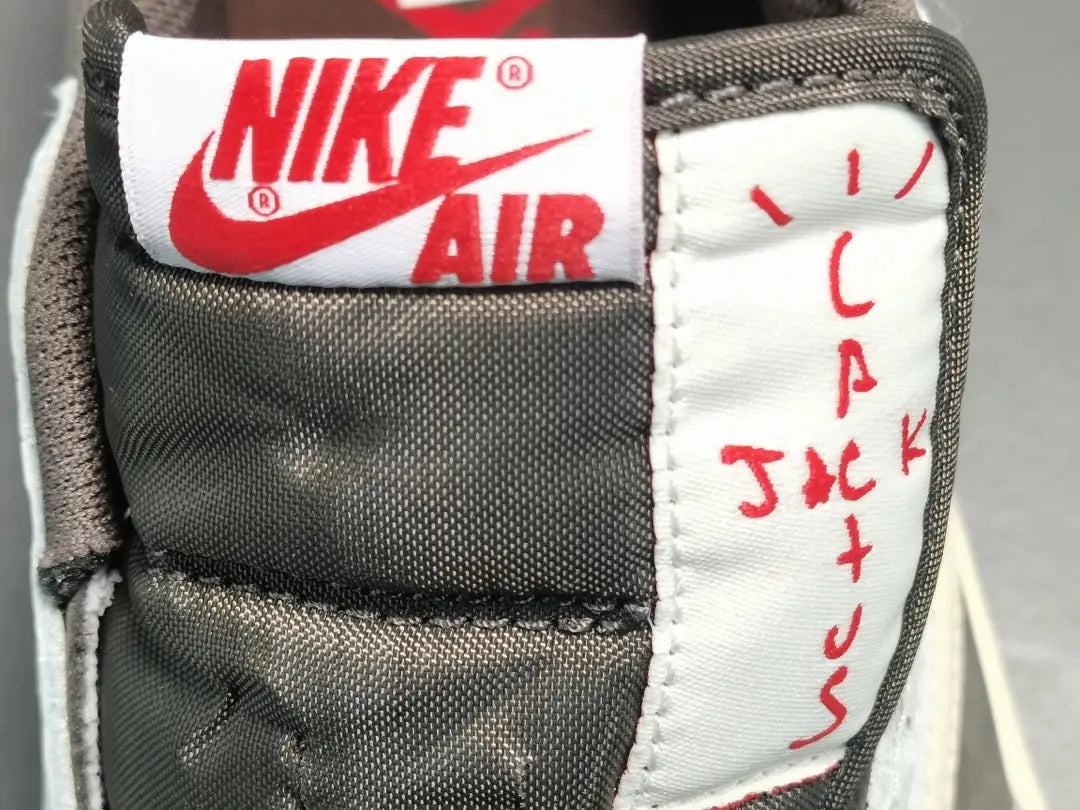 "Jordan 1 Low x Travis Scott Reverse Mocha – Mocha suede, reverse Swoosh, Cactus Jack branding, and vintage sail accents."