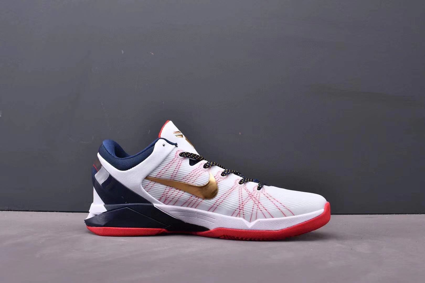 Nike Kobe 7 Gold Medal basketball shoes black with gold metallic accents
