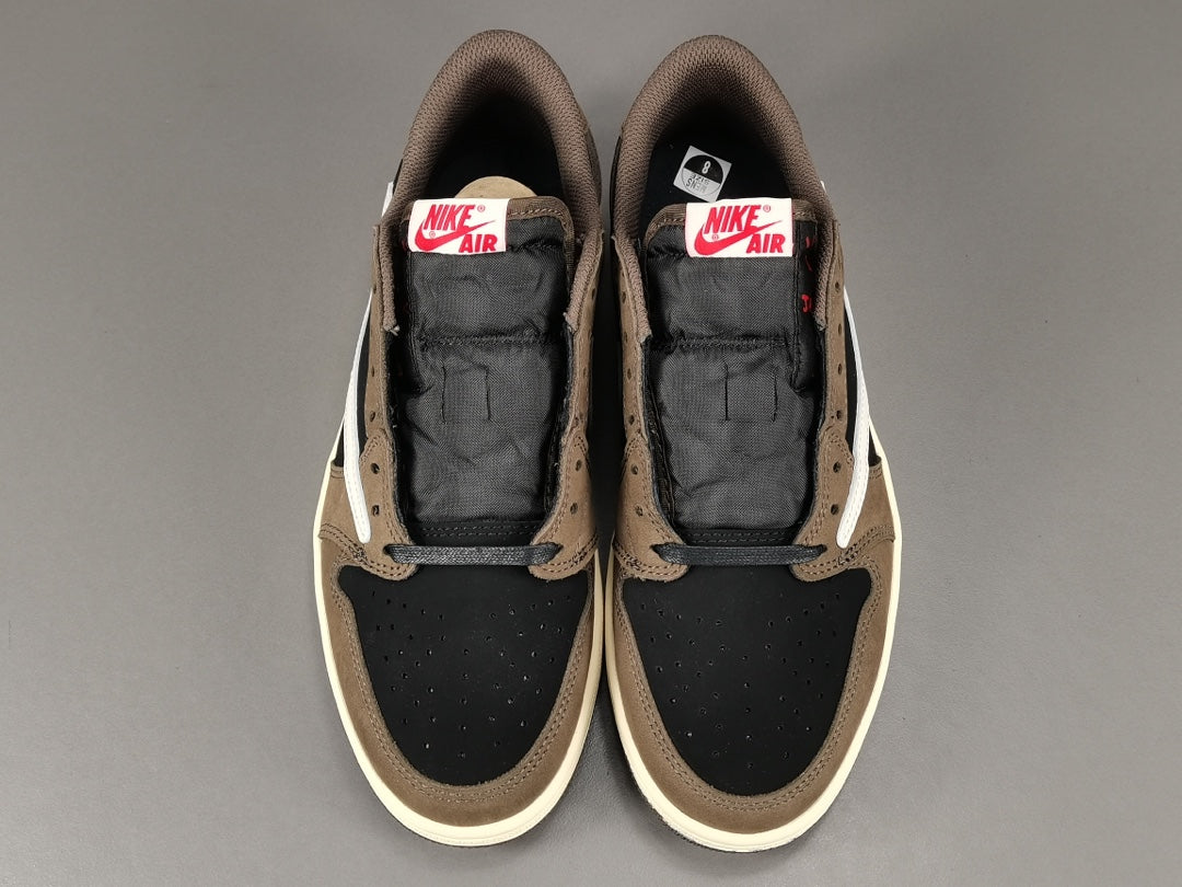 "Air Jordan 1 Low OG SP x Travis Scott sneakers featuring signature reverse Swoosh, premium materials, and Cactus Jack branding." 