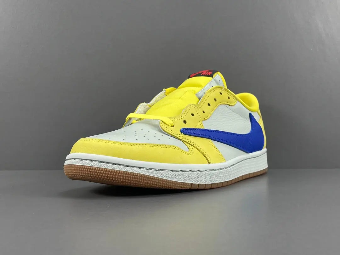 "Jordan 1 Low OG x Canary – low-top sneaker with premium leather upper, bright yellow and white colorway, and classic retro design."