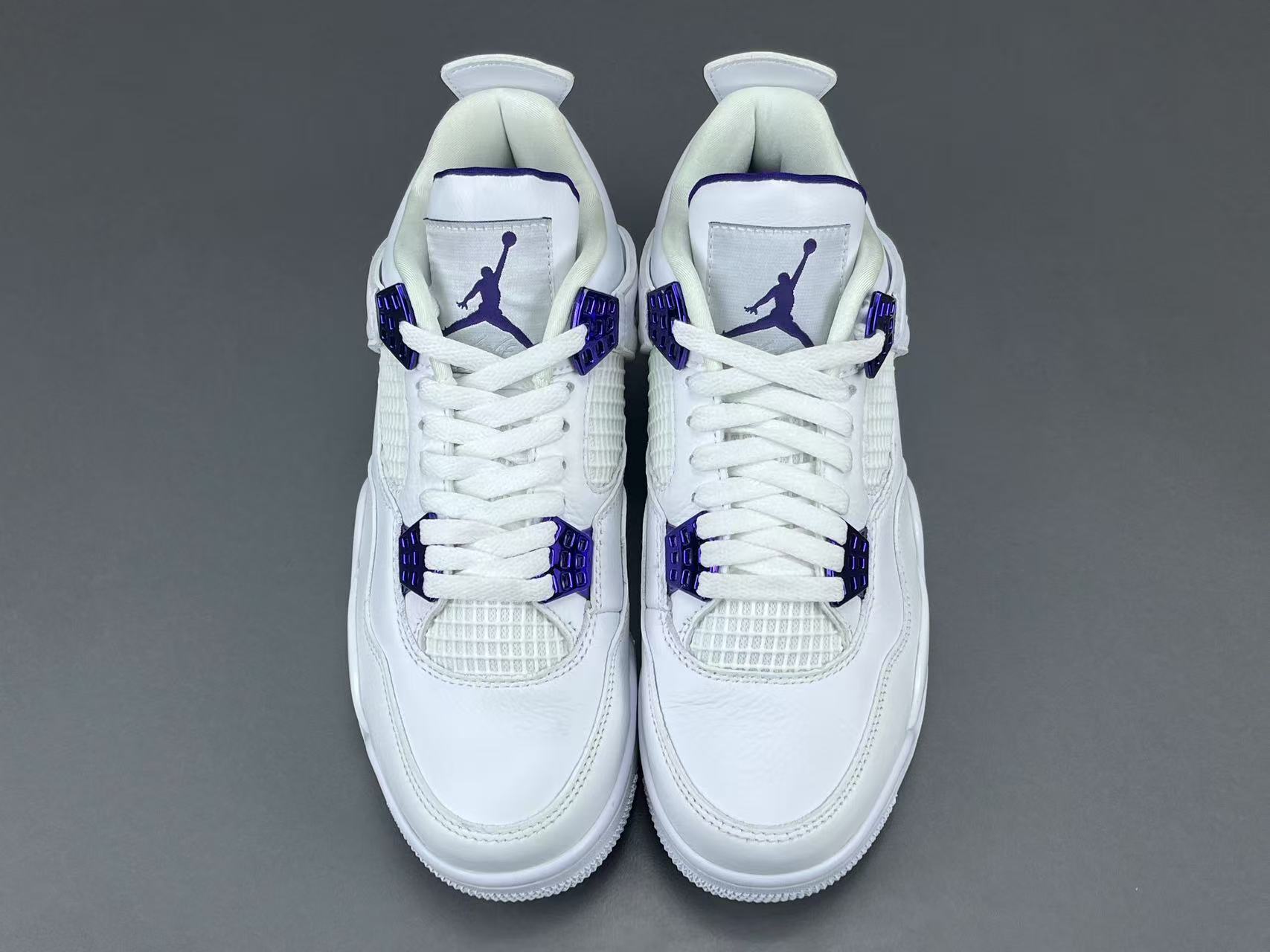 Air Jordan 4 Metallic Purple clean white sneakers with metallic purple details