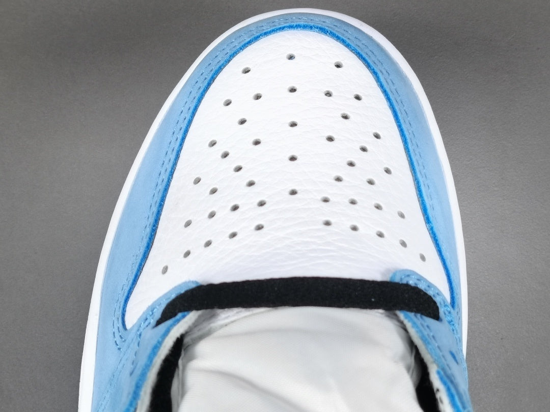 Jordan 1 Retro High OG University Blue sneakers with suede overlays and classic style.