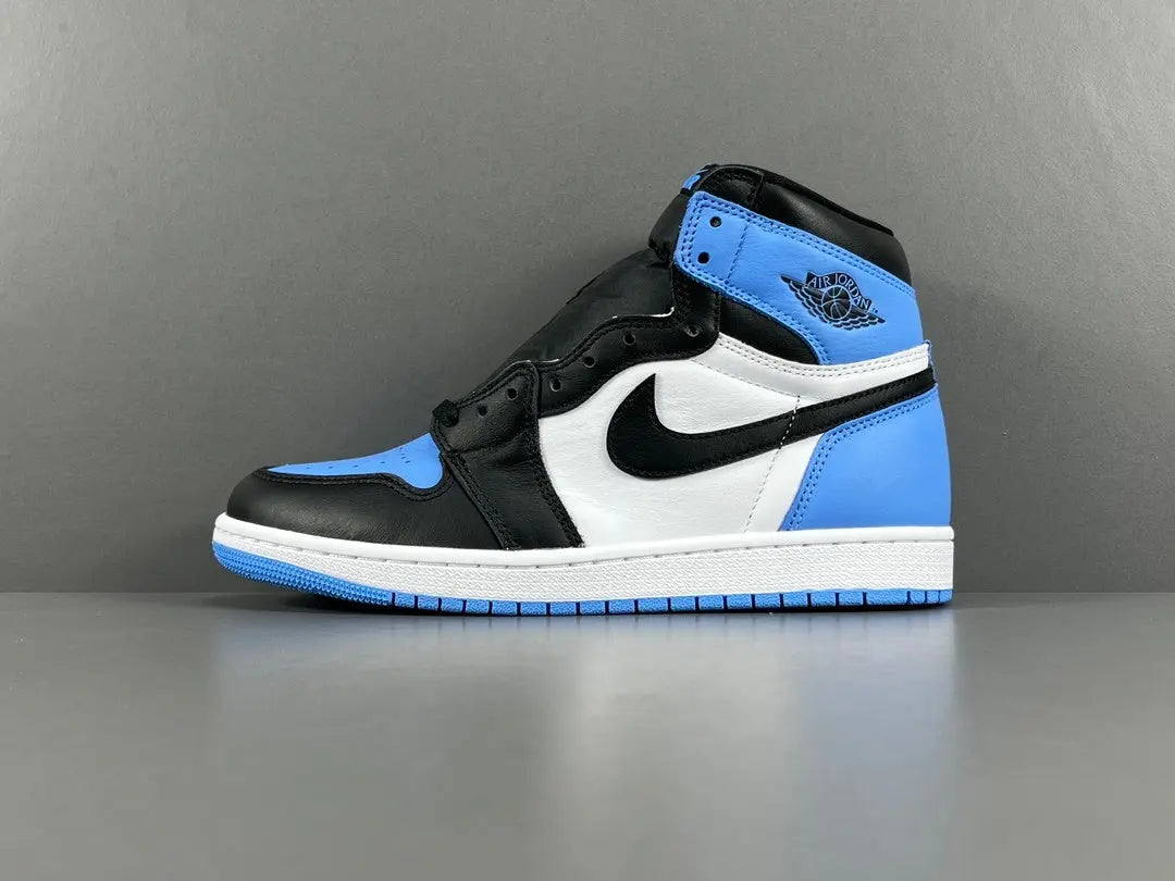 Air Jordan 1 High OG UNC Toe side view black white university blue sneaker