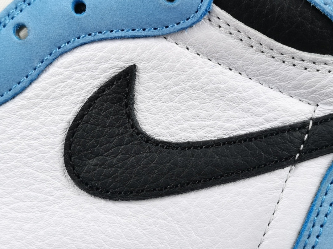 Jordan 1 Retro High OG University Blue sneakers with suede overlays and classic style.