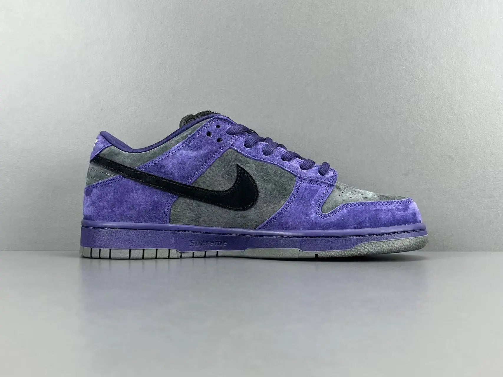 Nike SB Dunk Low x Supreme 94 Ink sneaker in deep blue leather
