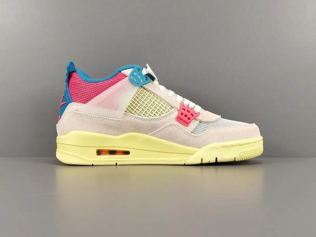 Multicolored sneaker with pink, blue, and yellow accents on a gray background