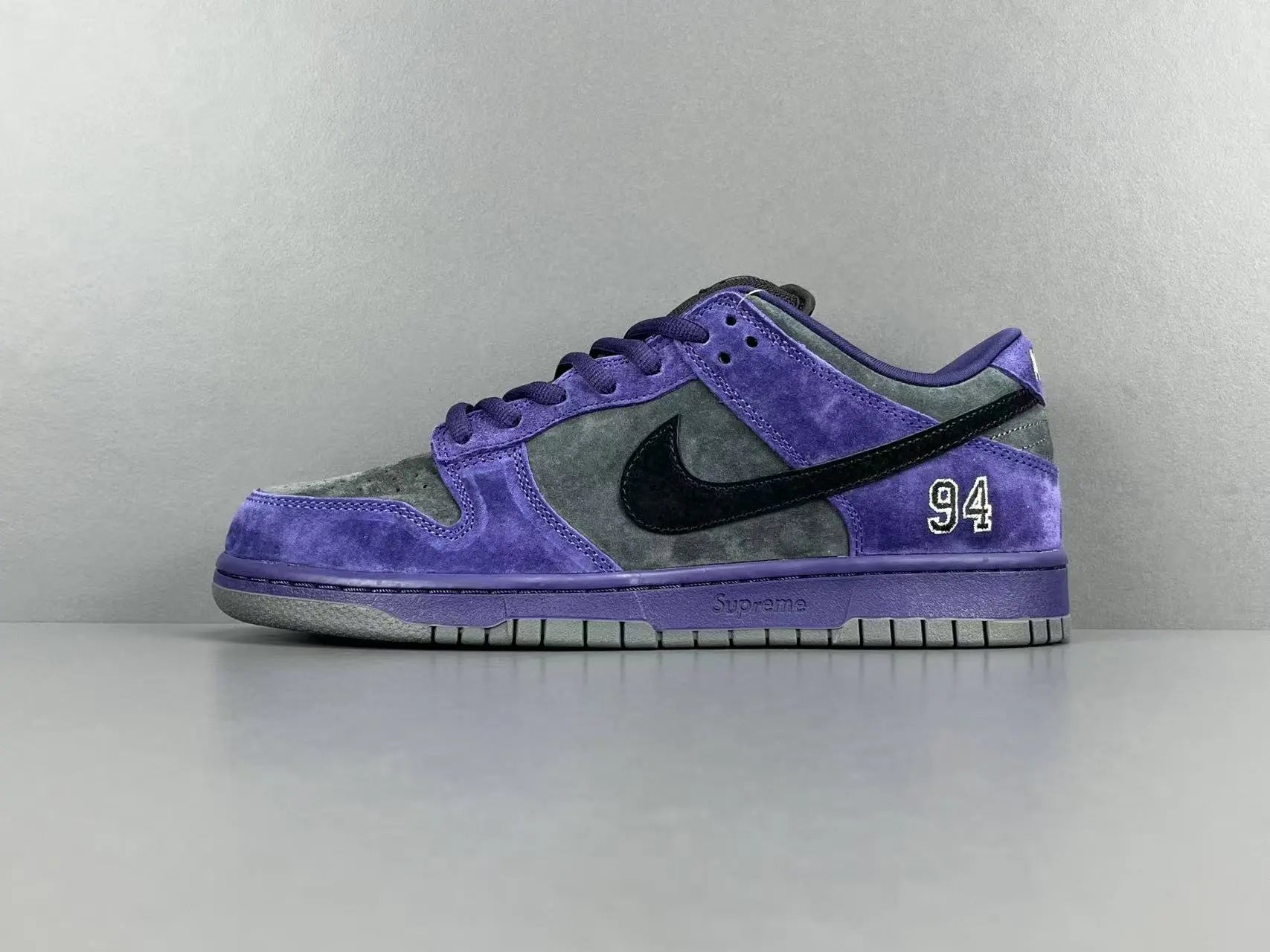 Nike SB Dunk Low x Supreme 94 Ink sneaker in deep blue leather
