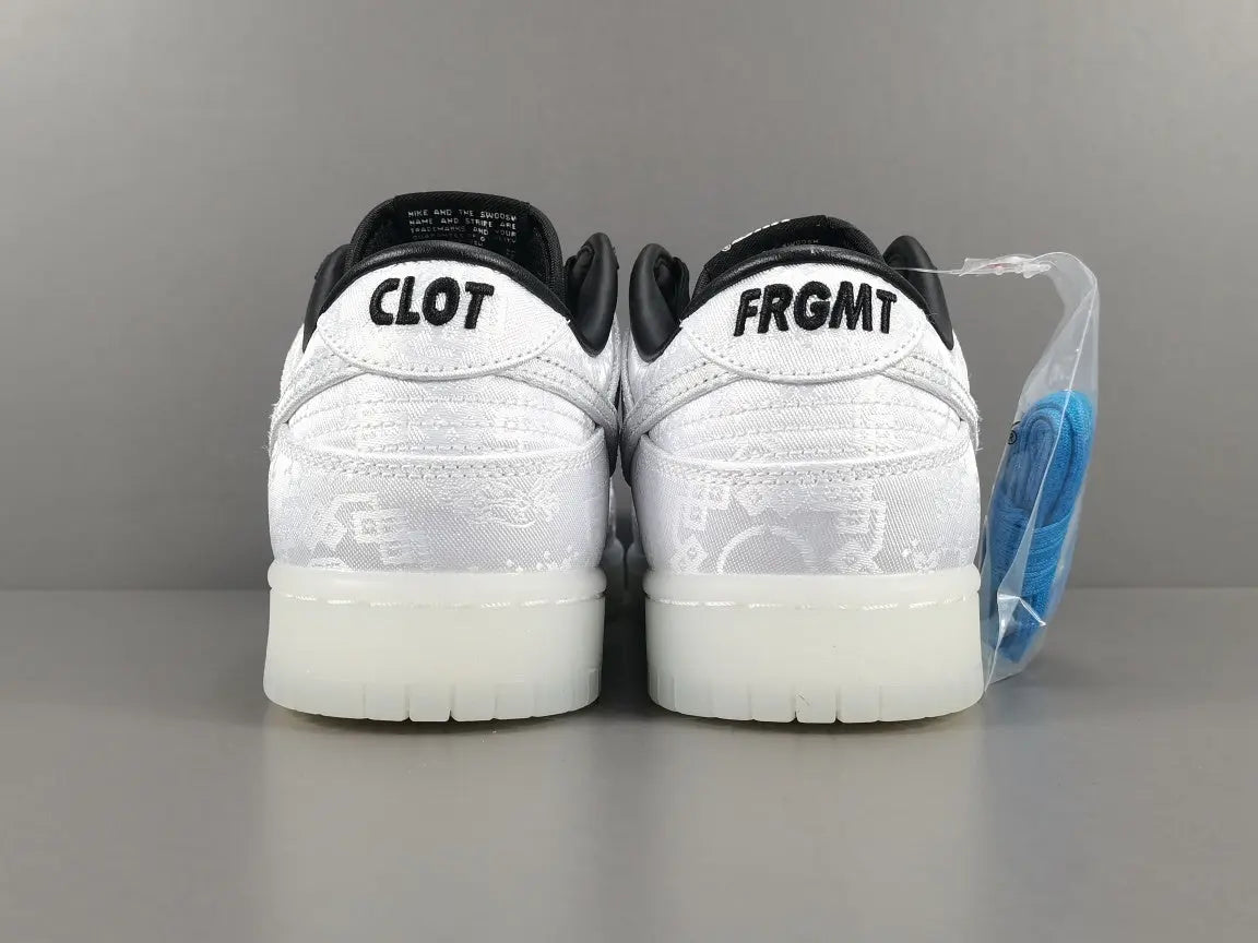 Nike Dunk Fragment White triple white low top sneaker clean side view