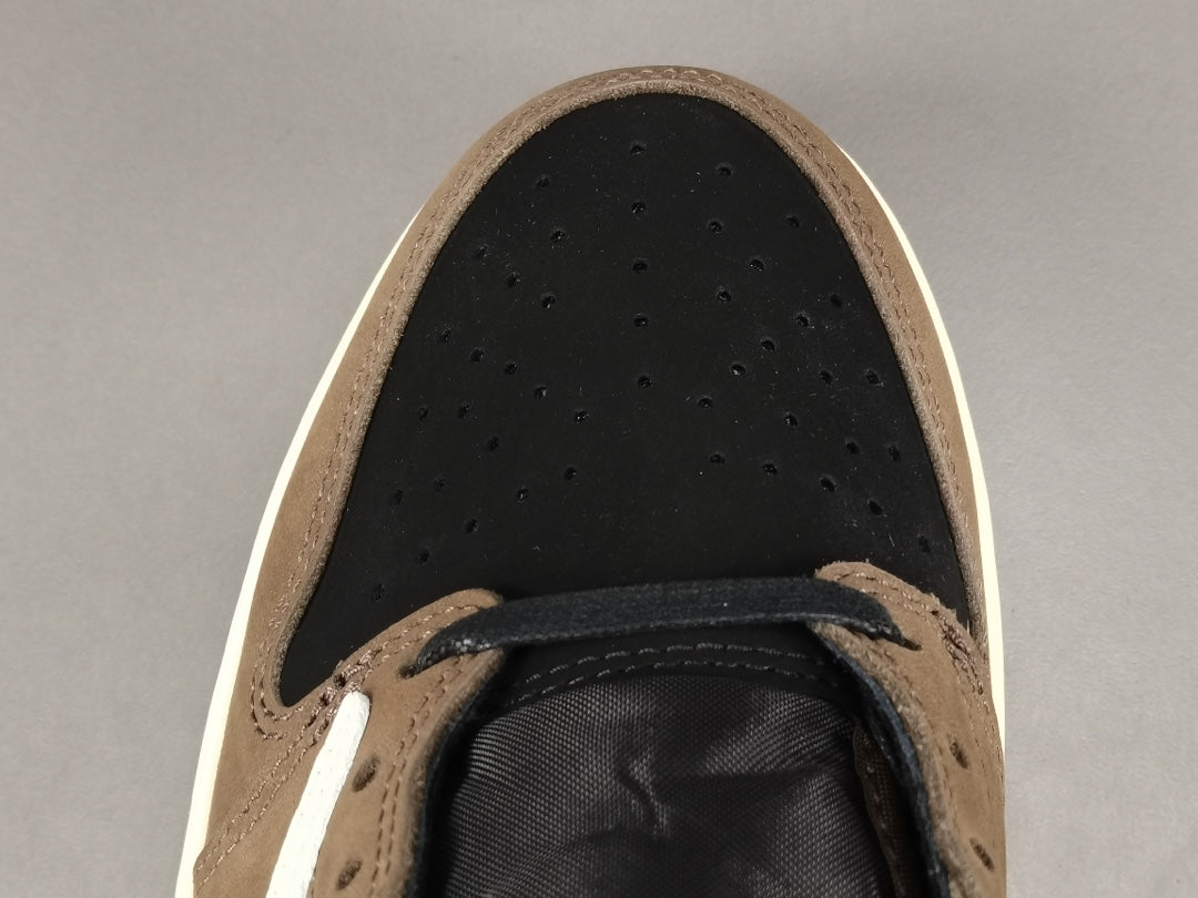 "Air Jordan 1 Low OG SP x Travis Scott sneakers featuring signature reverse Swoosh, premium materials, and Cactus Jack branding." 