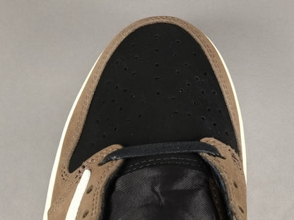 "Air Jordan 1 Low OG SP x Travis Scott sneakers featuring signature reverse Swoosh, premium materials, and Cactus Jack branding." 