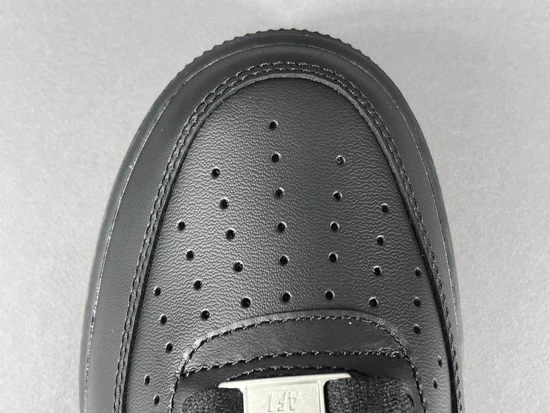 Nike Air Force 1 Black with classic silhouette, smooth leather upper, and all-black finish