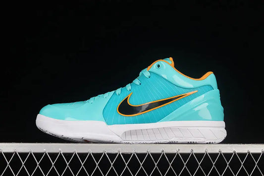 A Nike basketball shoe in a vibrant turquoise blue with a black Swoosh and orange trim, resting on a white metal grate against a solid black background.