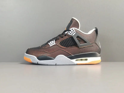 Brown sneaker with orange sole on a gray background