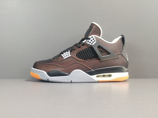 Brown sneaker with orange sole on a gray background