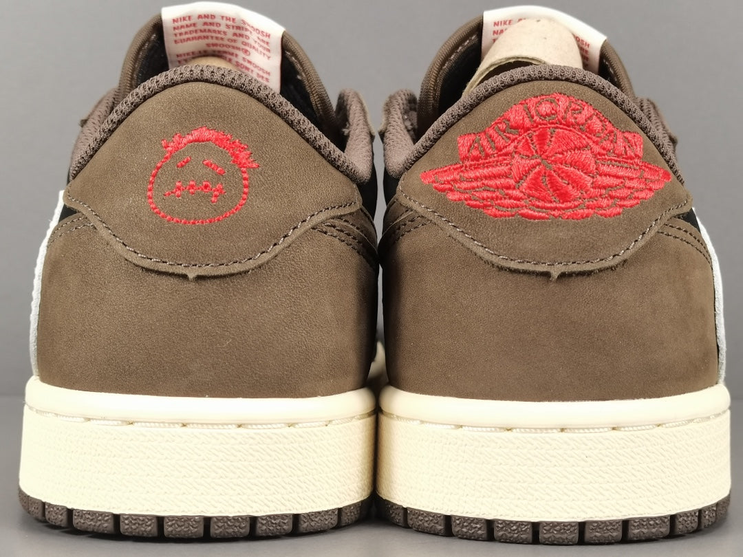 "Air Jordan 1 Low OG SP x Travis Scott sneakers featuring signature reverse Swoosh, premium materials, and Cactus Jack branding." 
