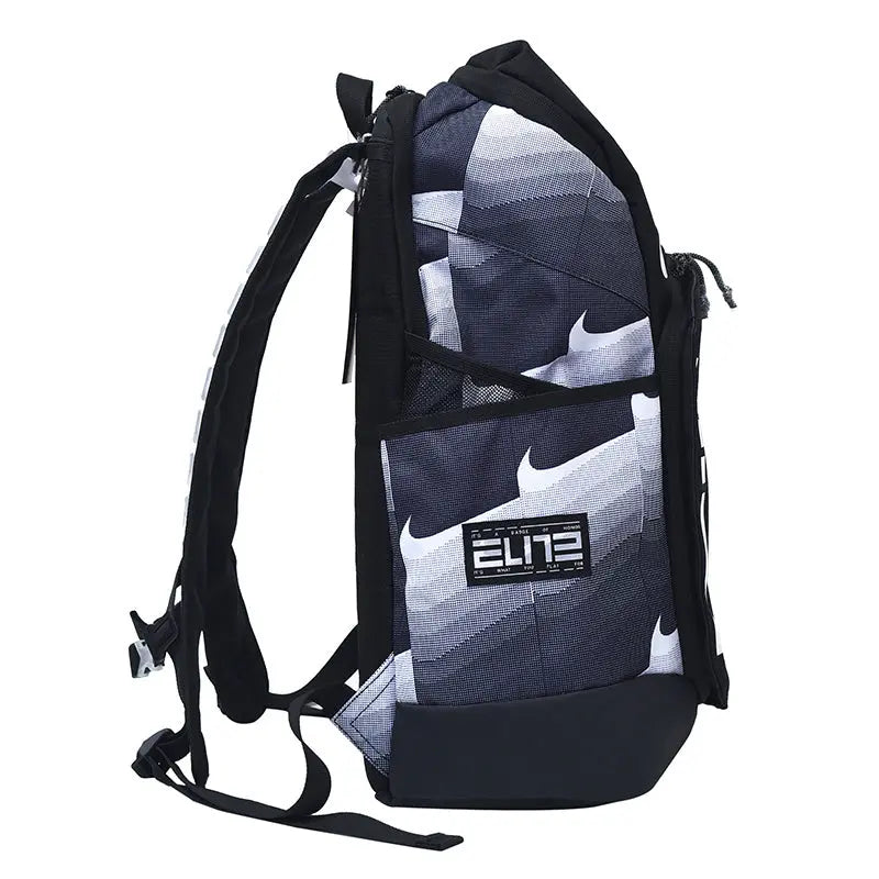 A Nike Elite backpack in a dark gray and white geometric pattern, featuring black straps, a black bottom base, and a black Nike Elite patch on the front pocket.