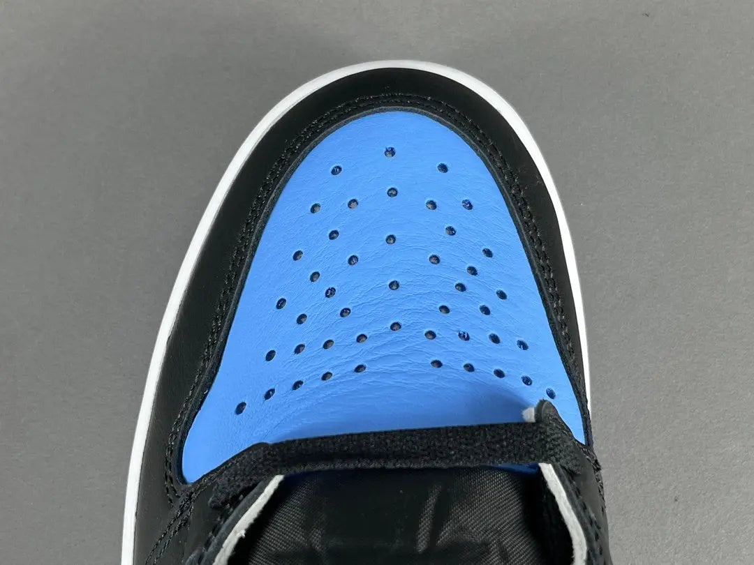 Air Jordan 1 High OG UNC Toe side view black white university blue sneaker