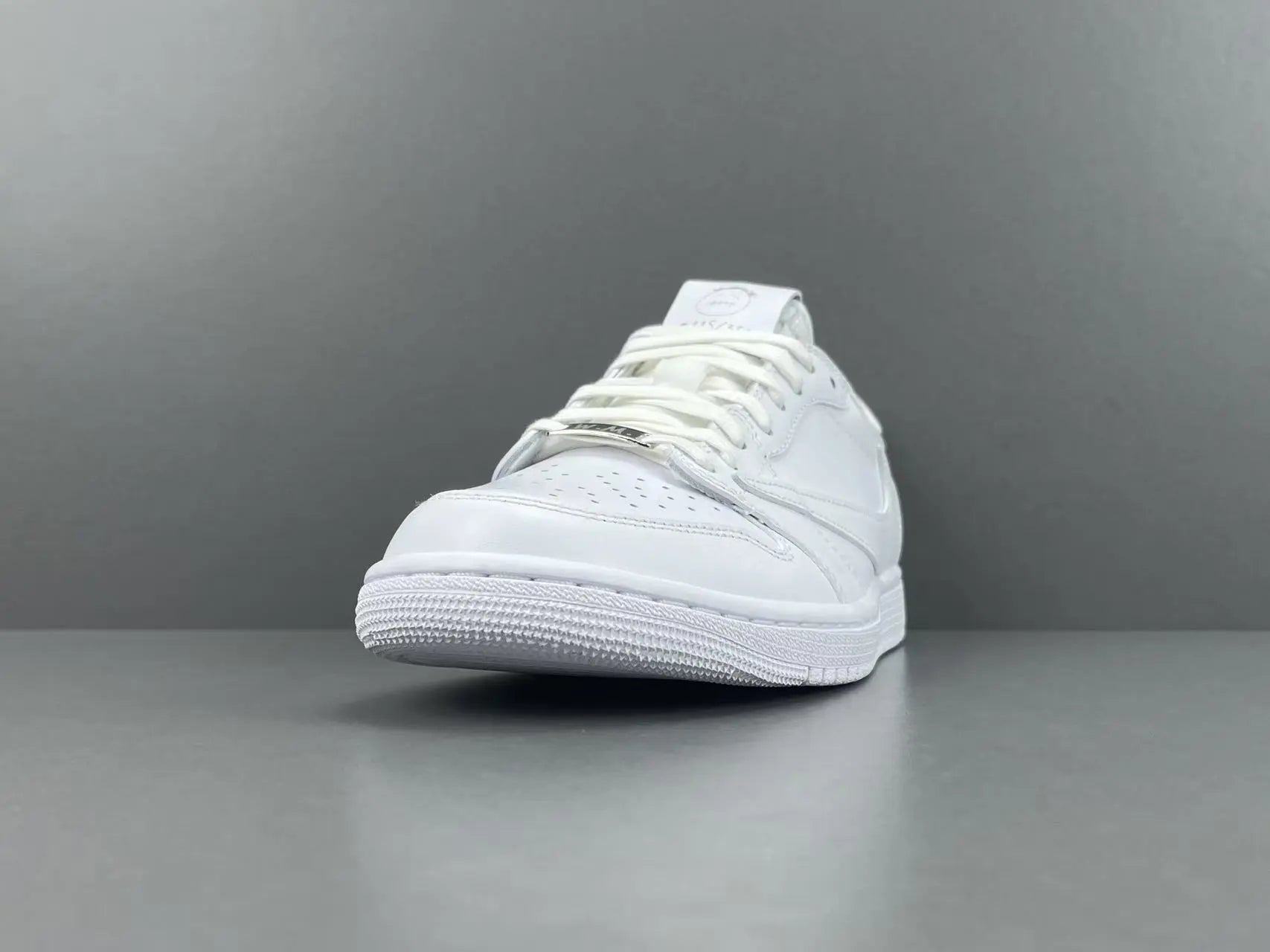 Air Jordan 1 Low Travis Scott White side view reverse Swoosh leather sneaker