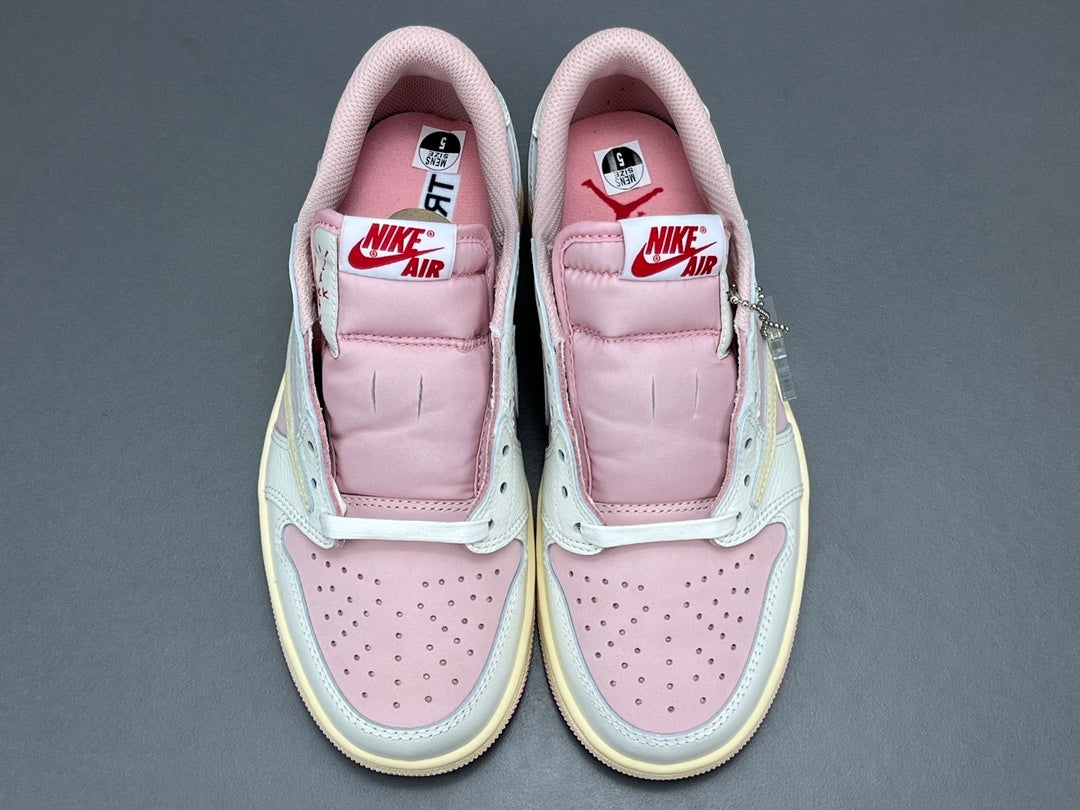 Jordan 1 Low x Travis Scott Shy Pink sneakers with reversed Swoosh design