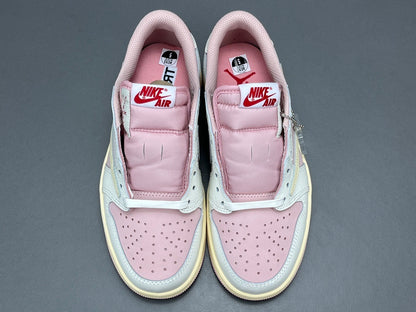 Jordan 1 Low x Travis Scott Shy Pink sneakers with reversed Swoosh design