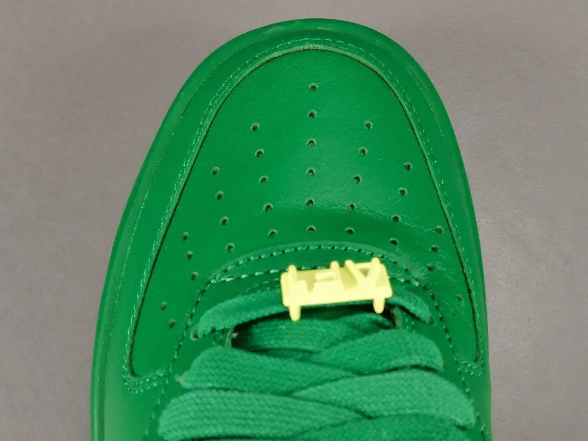 Nike Air Force 1 x AMBUSH Pine Green sneaker with oversized Swoosh design
