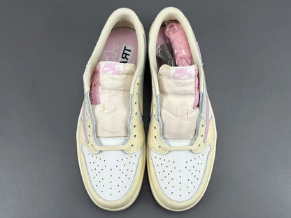 Jordan 1 Low Travis Scott Muslin Shy Pink sneakers with reverse Swoosh
